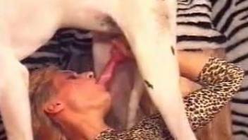 Bodysuit-wearing blonde fucking a horny white dog