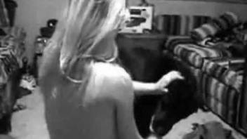 B&W bestiality scene featuring a horny blondie