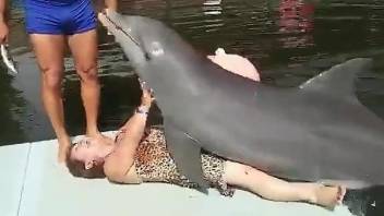 Old lady gets dry-humped by a really horny dolphin