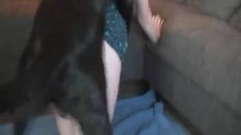 Blond-haired teen amateur fucks a kinky black dog