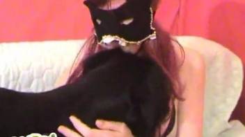 Masked chick seducing a big-dicked black pooch