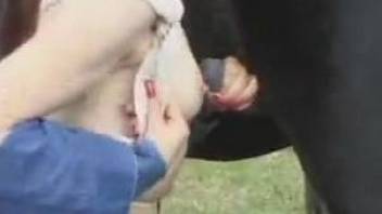 Redheaded beauty fucks herself before fucking a horse